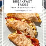 Pinterest image of breakfast tacos on a tan plate with the Check saying Texas style bacon and egg breakfast tacos.
