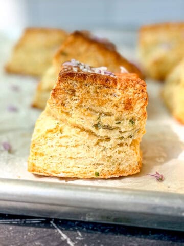 Chive blossom biscuits on parchment paper.