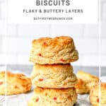 Pinterest image of a stack of pimento cheese biscuits.