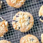 Top view of a blueberry muffin top on a wire rack.