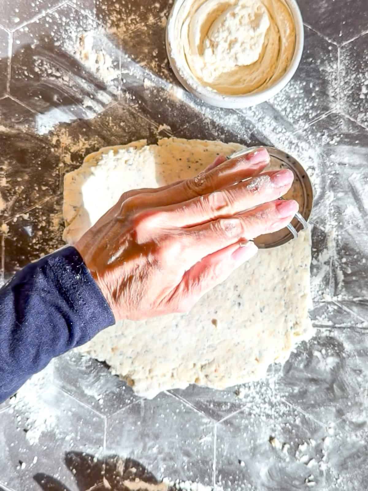 Cutting out biscuits on a black background.