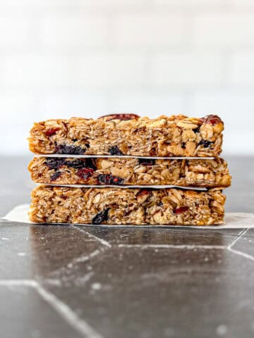 Stack of granola bars on a Black counter.