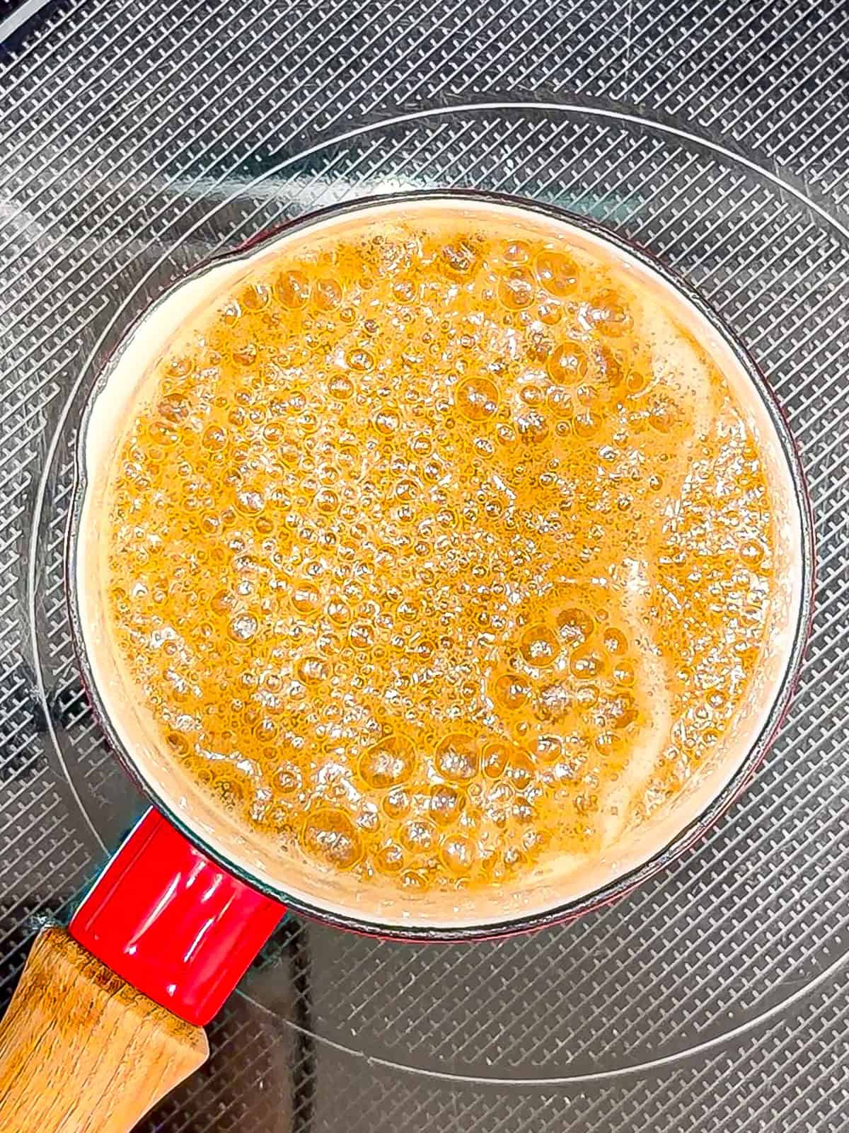 Butter syrup simmering in a small sauce pan.