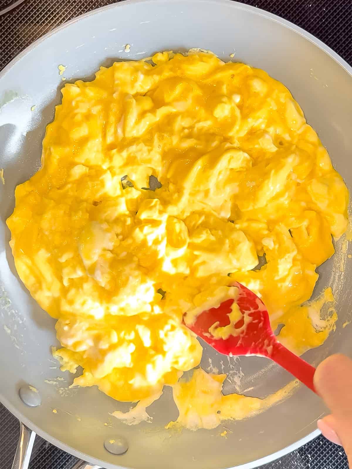 Cooked t mascarpone eggs in a nonstick pan.