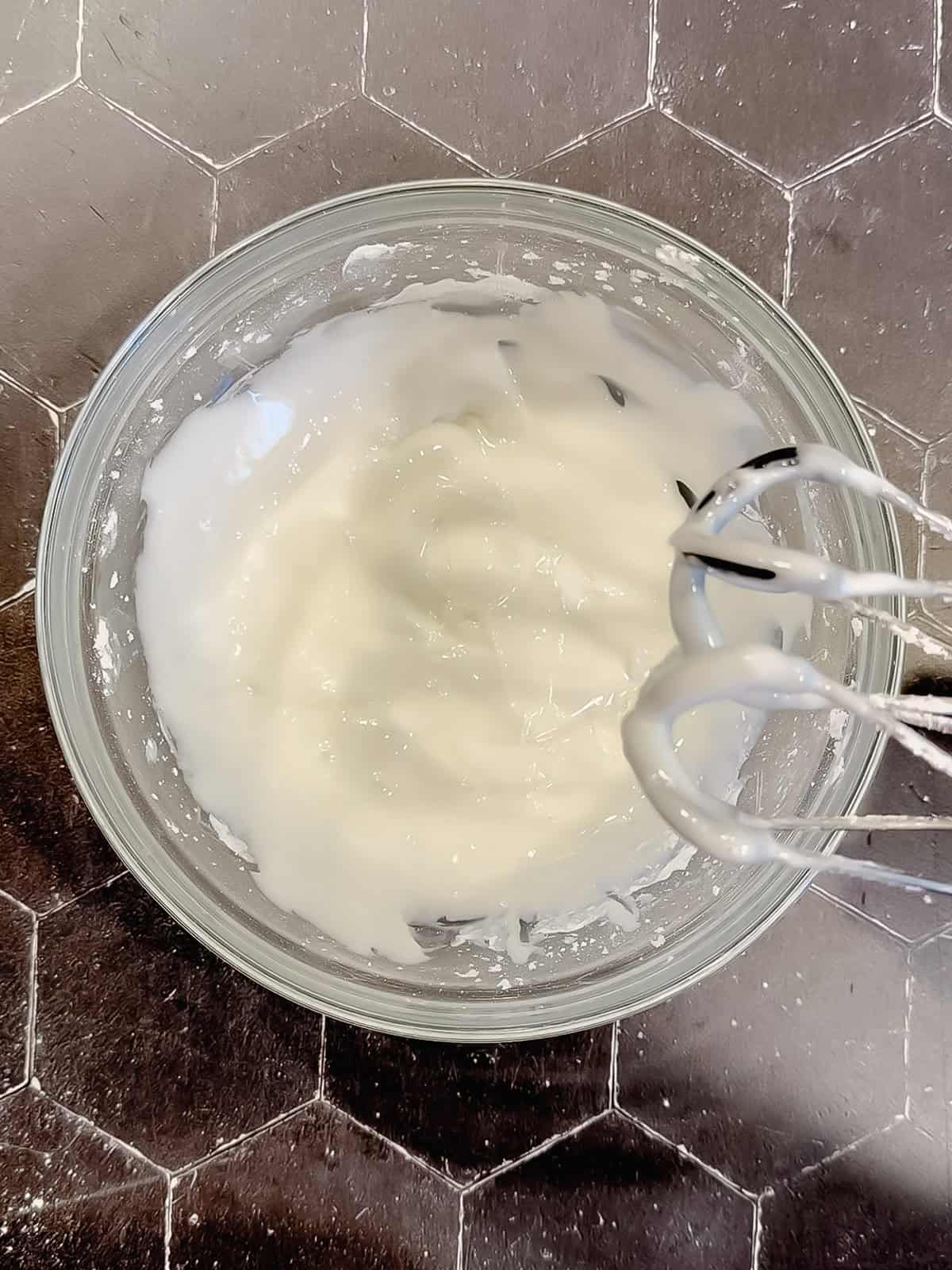 Lemon glaze in a glass bowl.