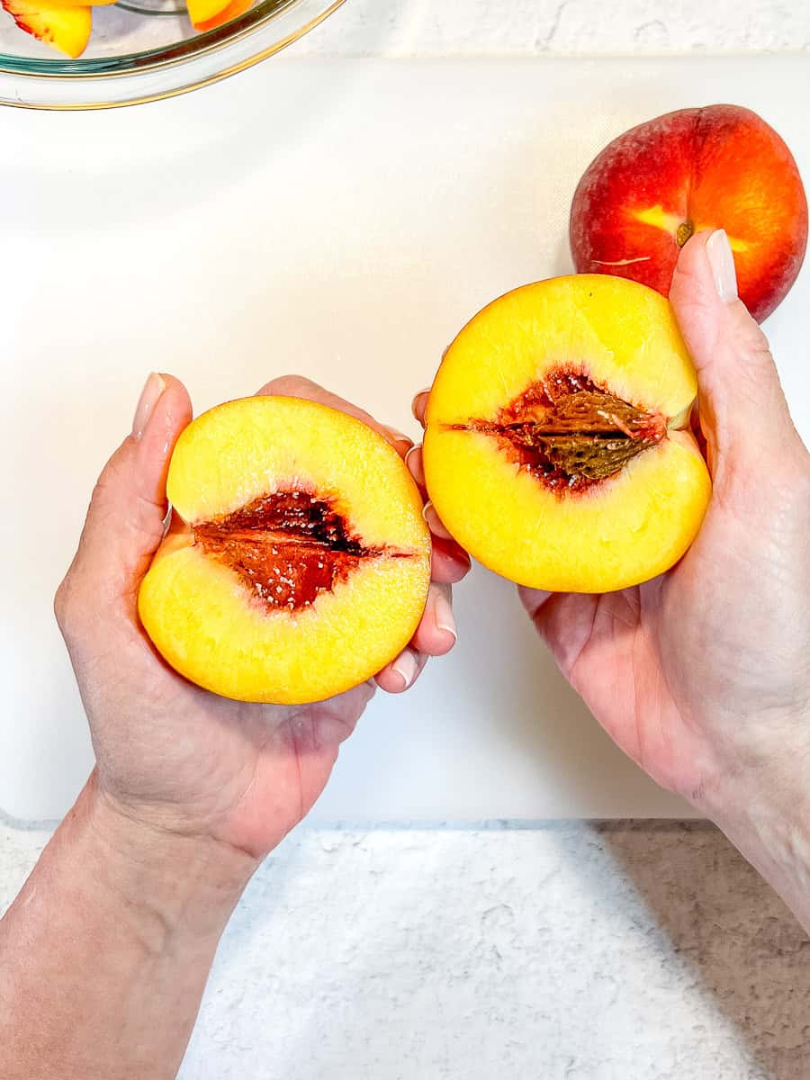 Twisting open a peach.