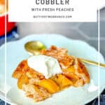 Pinterest image of a scoop of peach cobbler on a white plate, topped with whipped cream.