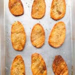 Crispy baked accordion potatoes on a sheet pan.