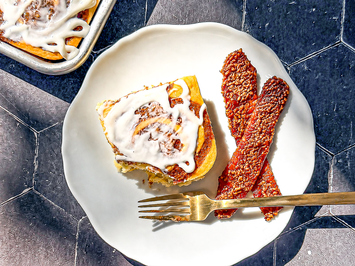 Cinnamon roll sheet pan pancakes with a side of maple pecan bacon.