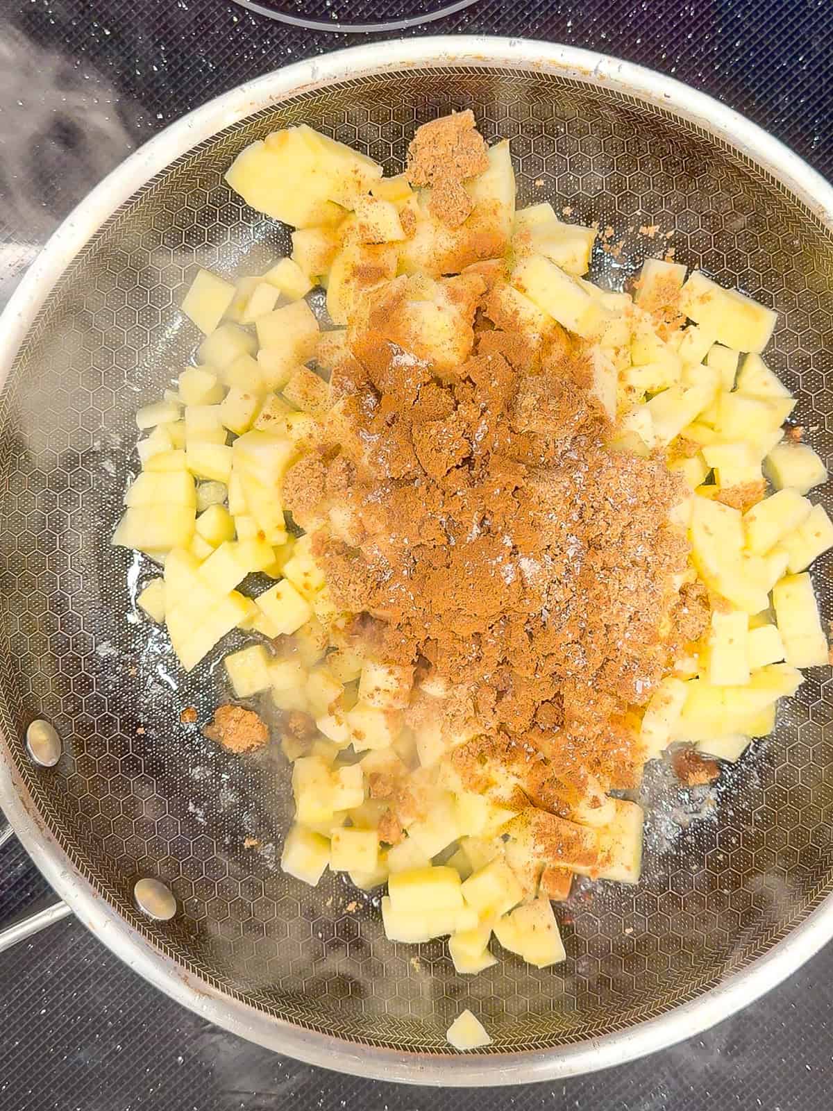 Cooking apples in a skillet.