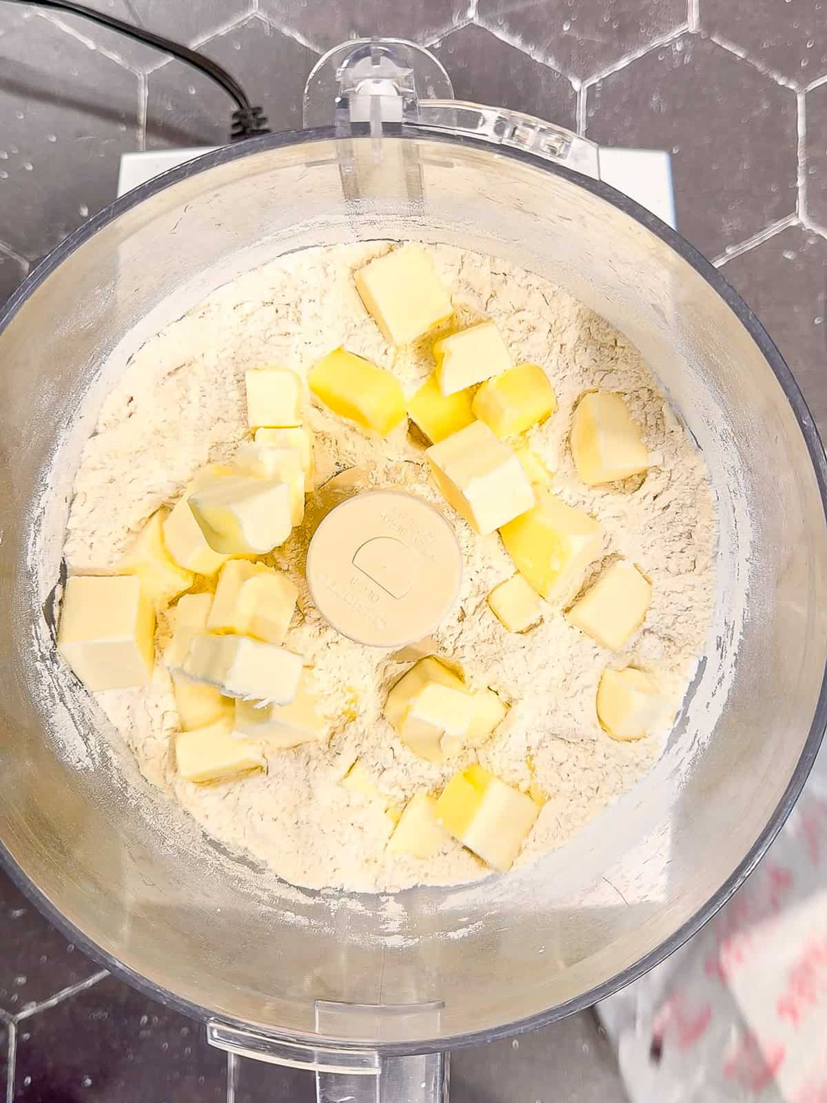 Pie crust ingredients in a food processor.